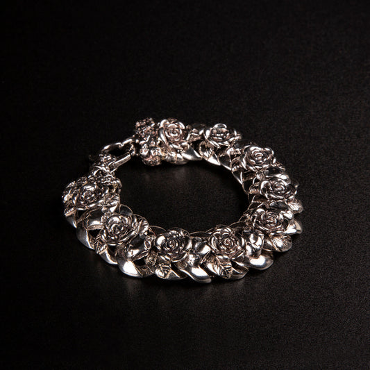 Bracciale grumettone in argento925 con teschi e rose