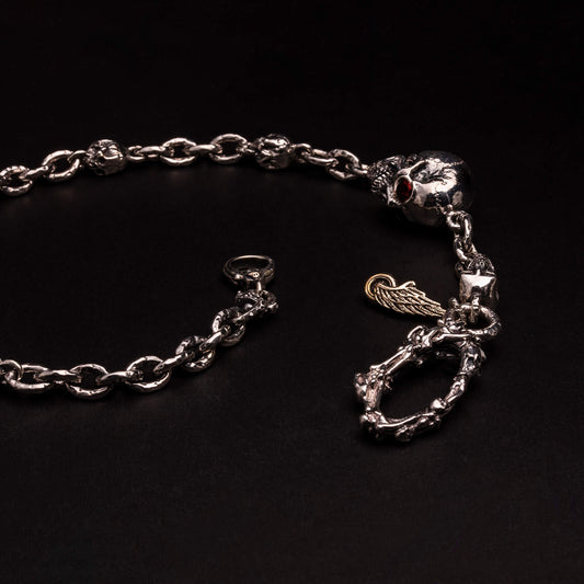 Catena per portafoglio in argento925, maglie rolo', teschio impreziosito da granati, moschettone lavorato.